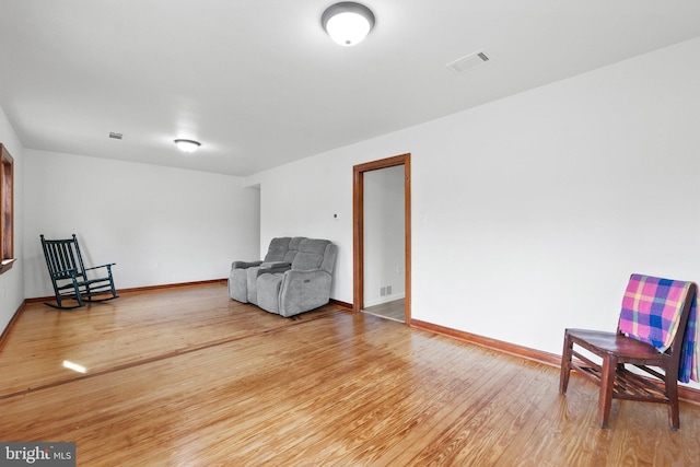 sitting room featuring hardwood / wood-style flooring