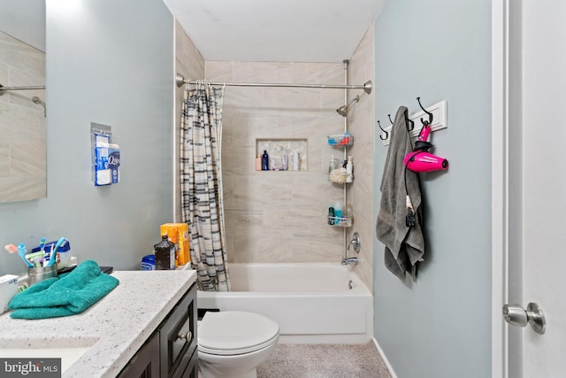 full bathroom with vanity, toilet, and shower / bath combo with shower curtain