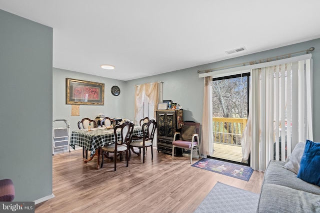 dining area with light hardwood / wood-style flooring