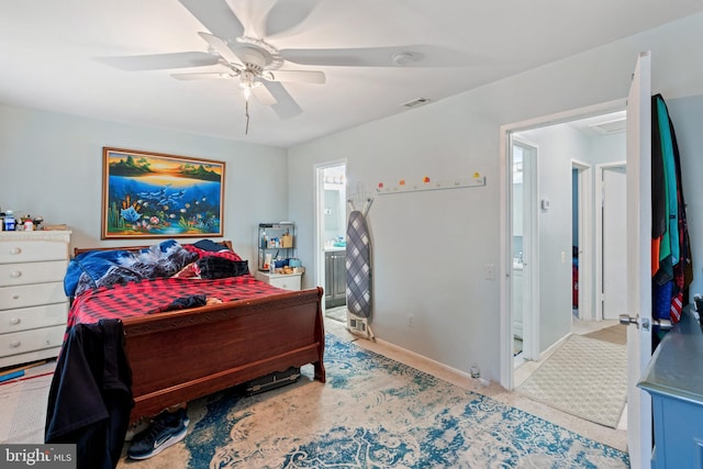 bedroom with ensuite bathroom and ceiling fan