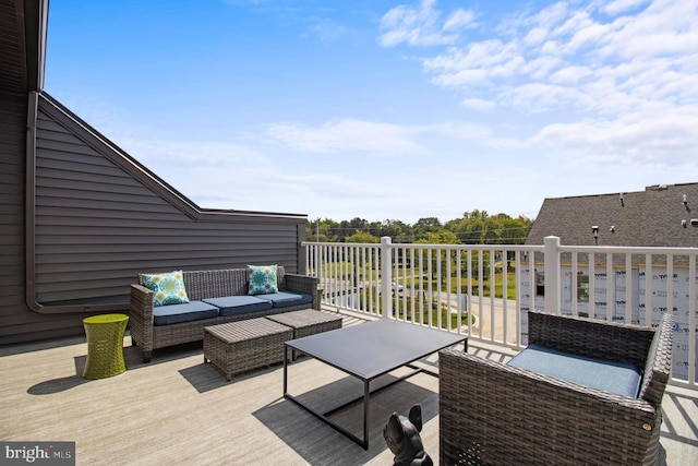 wooden deck with outdoor lounge area