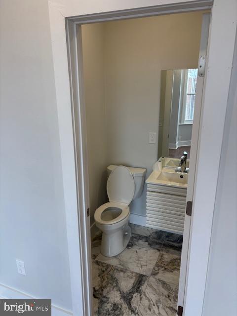 bathroom featuring sink and toilet