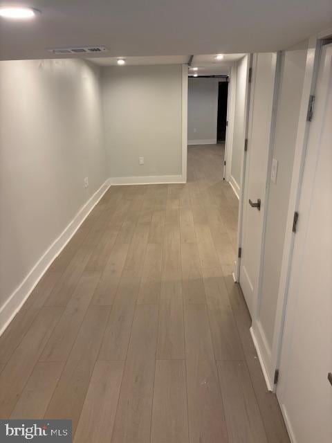 basement featuring light wood-type flooring