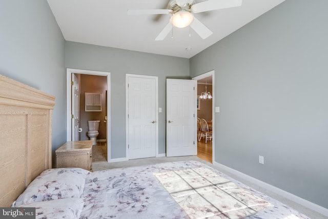 bedroom with ceiling fan and ensuite bath