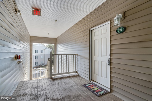 view of exterior entry with covered porch