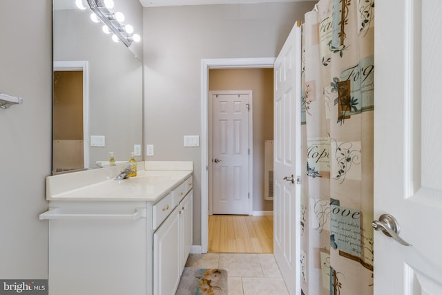 bathroom with tile patterned flooring and vanity