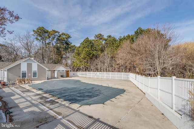 view of swimming pool featuring a patio area