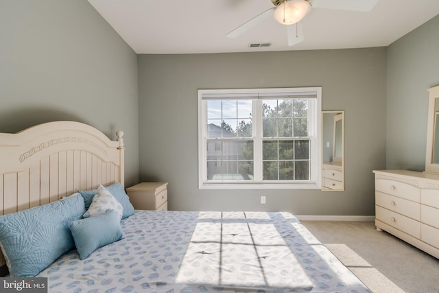 bedroom featuring light carpet and ceiling fan