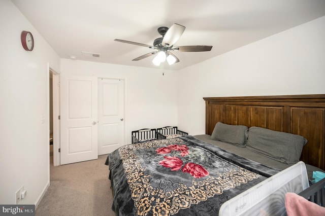 carpeted bedroom with ceiling fan