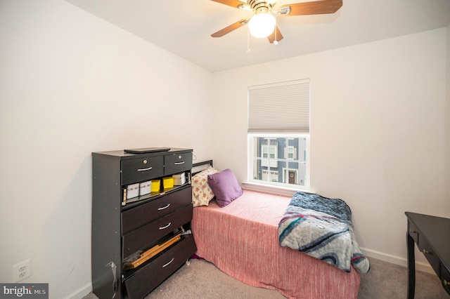 bedroom featuring light carpet and ceiling fan