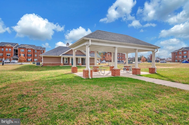 exterior space featuring a gazebo and a lawn