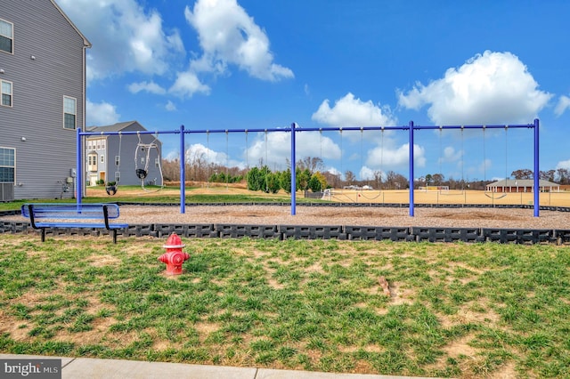 view of jungle gym with a yard and volleyball court