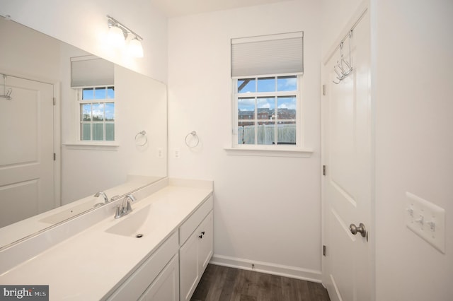 bathroom with vanity and hardwood / wood-style floors