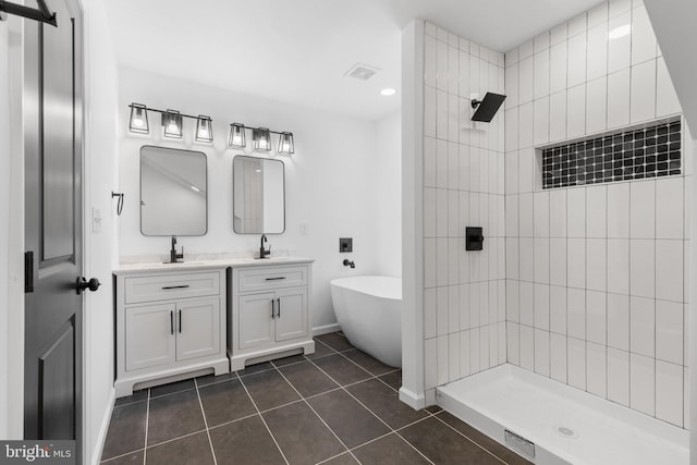 bathroom with vanity, tile patterned floors, and separate shower and tub