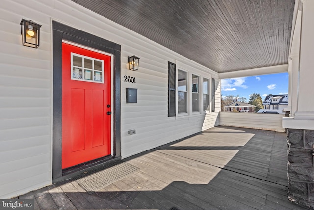 entrance to property featuring a porch