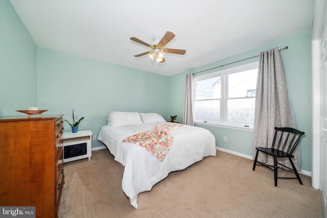 bedroom with carpet flooring, ceiling fan, and baseboards