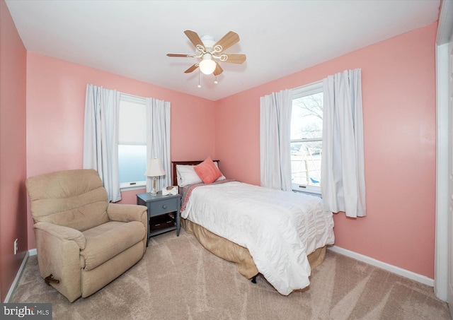 bedroom featuring ceiling fan, carpet flooring, and baseboards