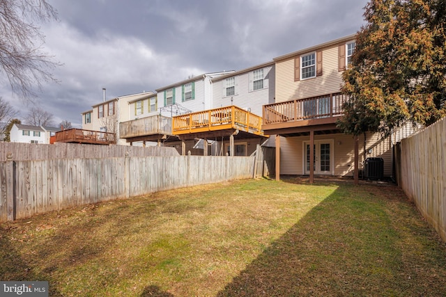 back of house with french doors, a deck, a lawn, and central air condition unit