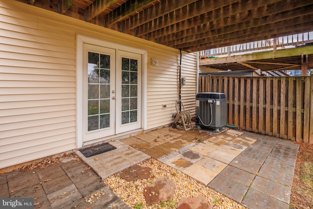 view of patio / terrace with central AC and french doors