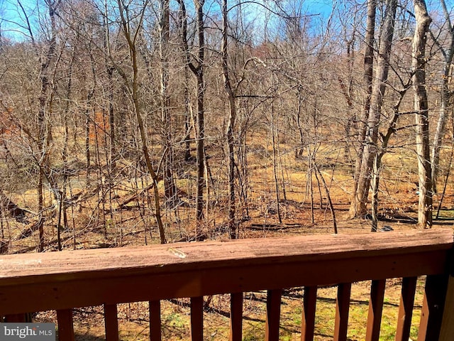 view of yard with a view of trees