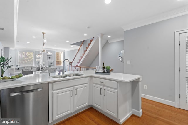 kitchen with sink, crown molding, dishwasher, light hardwood / wood-style floors, and white cabinets