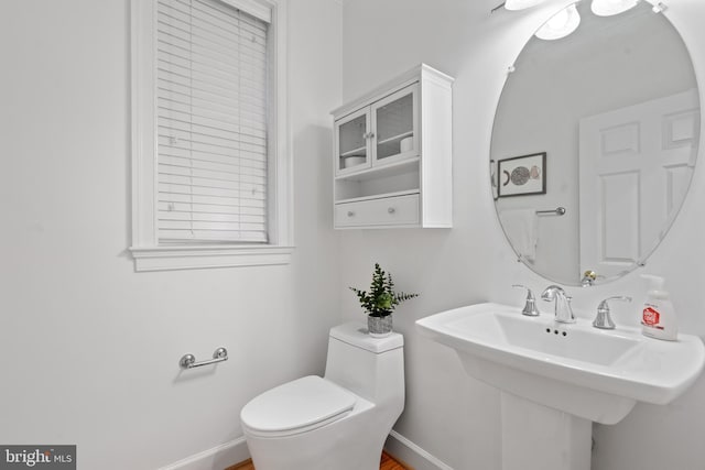 bathroom featuring sink and toilet