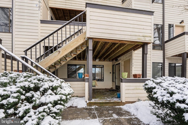 view of snow covered property entrance