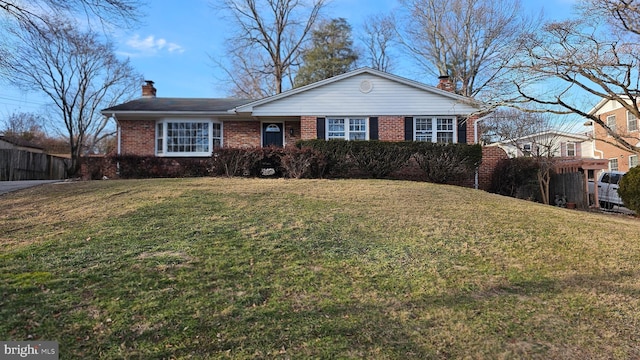 single story home with a front yard