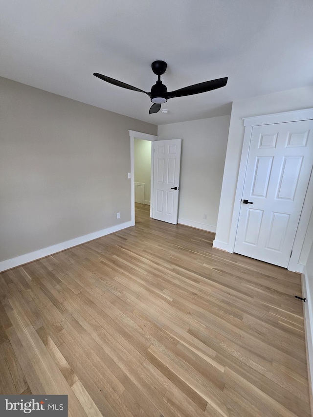 unfurnished bedroom featuring ceiling fan and light hardwood / wood-style flooring