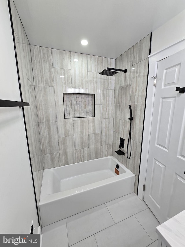 bathroom featuring tiled shower / bath combo and tile patterned floors