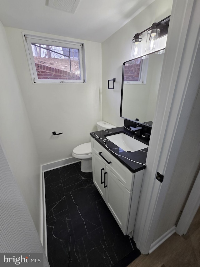 bathroom with vanity and toilet