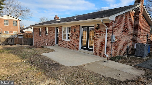 back of house featuring cooling unit and a patio area