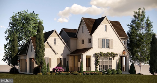 view of front facade featuring a garage and a front yard