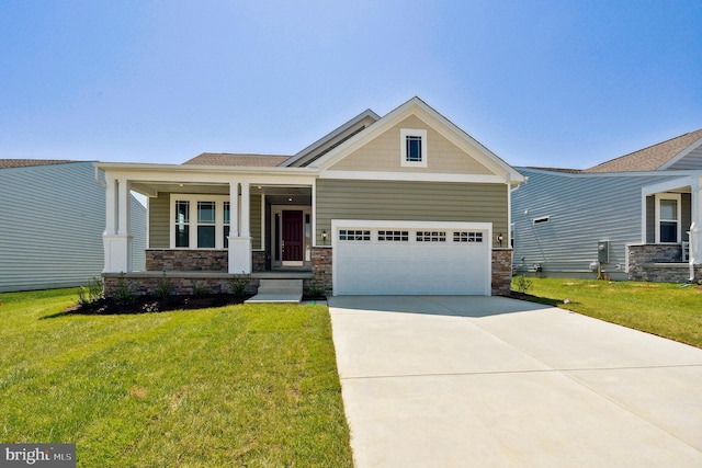 craftsman-style home featuring a garage, a front yard, and a porch