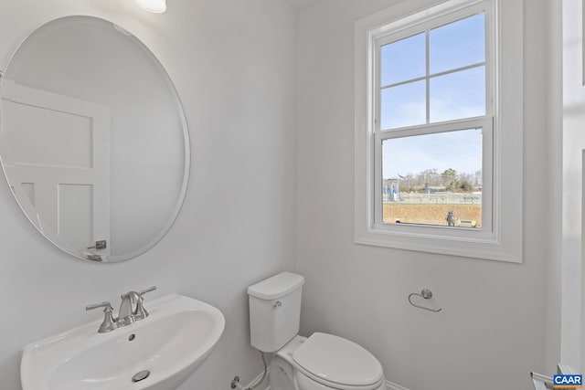 bathroom with toilet and sink