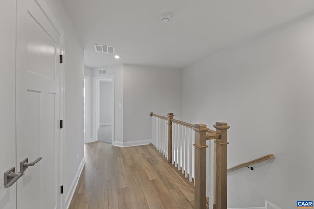 corridor with light wood-type flooring