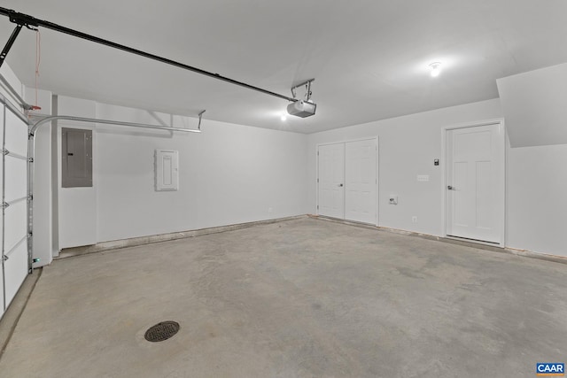 garage featuring a garage door opener and electric panel