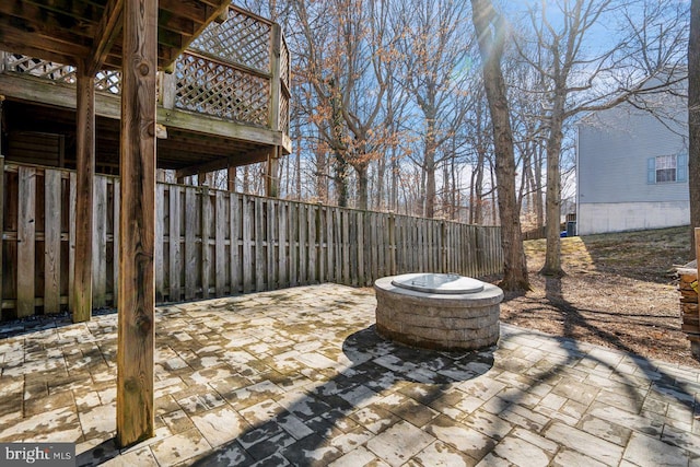 view of patio with a fire pit