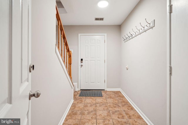 entryway featuring light tile patterned floors