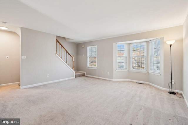 unfurnished room with light colored carpet