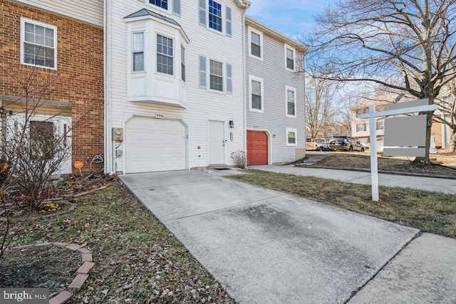 view of side of property with a garage