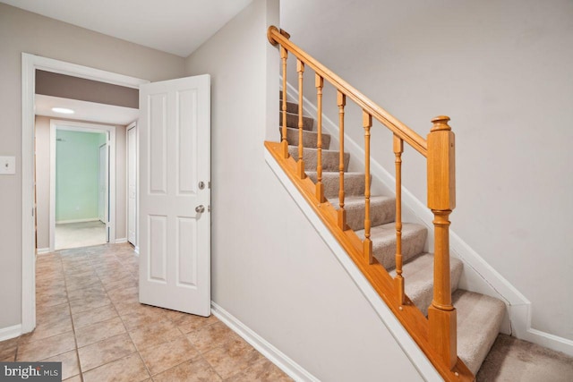 stairs with tile patterned flooring