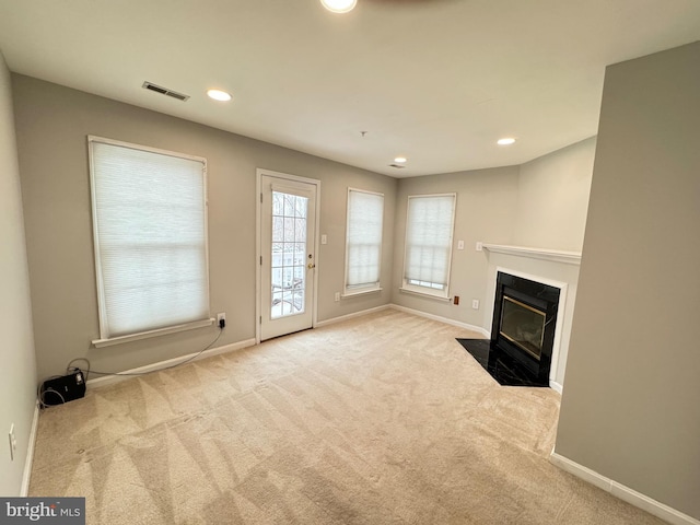 unfurnished living room with light carpet