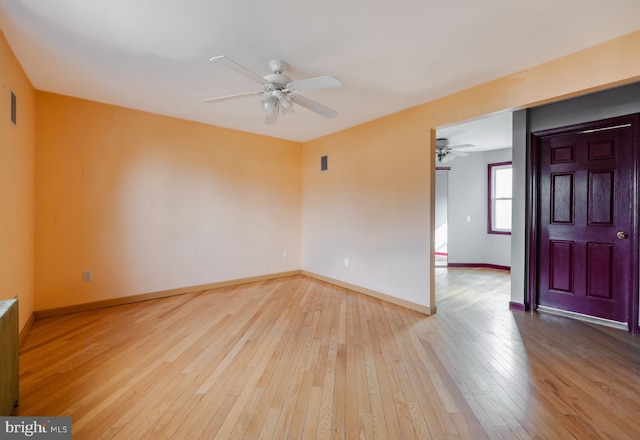 unfurnished room with ceiling fan and light hardwood / wood-style flooring