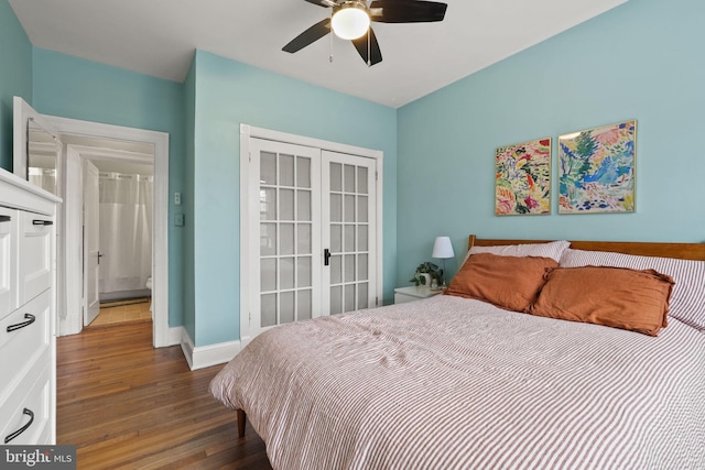 bedroom with dark wood-type flooring, french doors, and ceiling fan