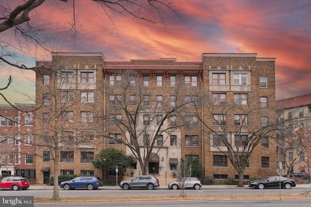 view of outdoor building at dusk