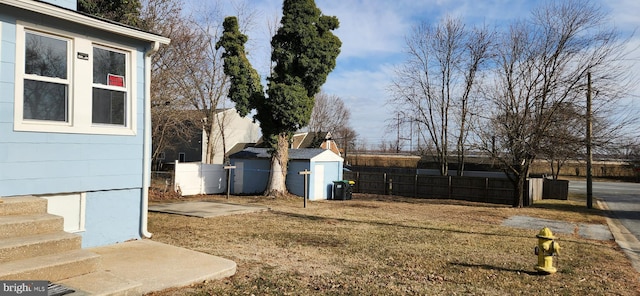 view of yard with a storage shed