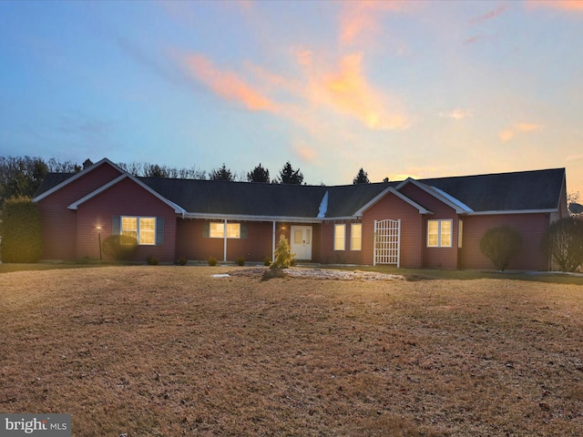 ranch-style house with a lawn