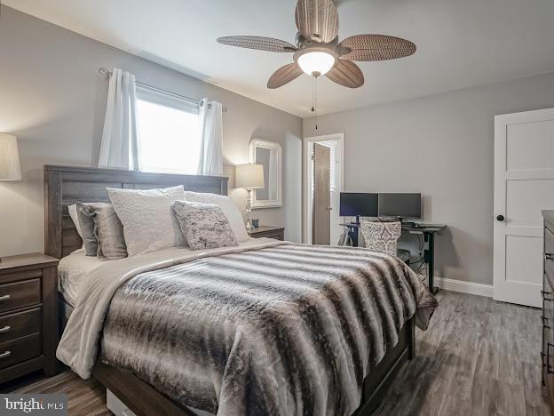 bedroom featuring ceiling fan and wood-type flooring