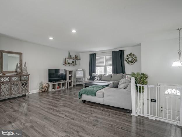 living room with dark hardwood / wood-style floors